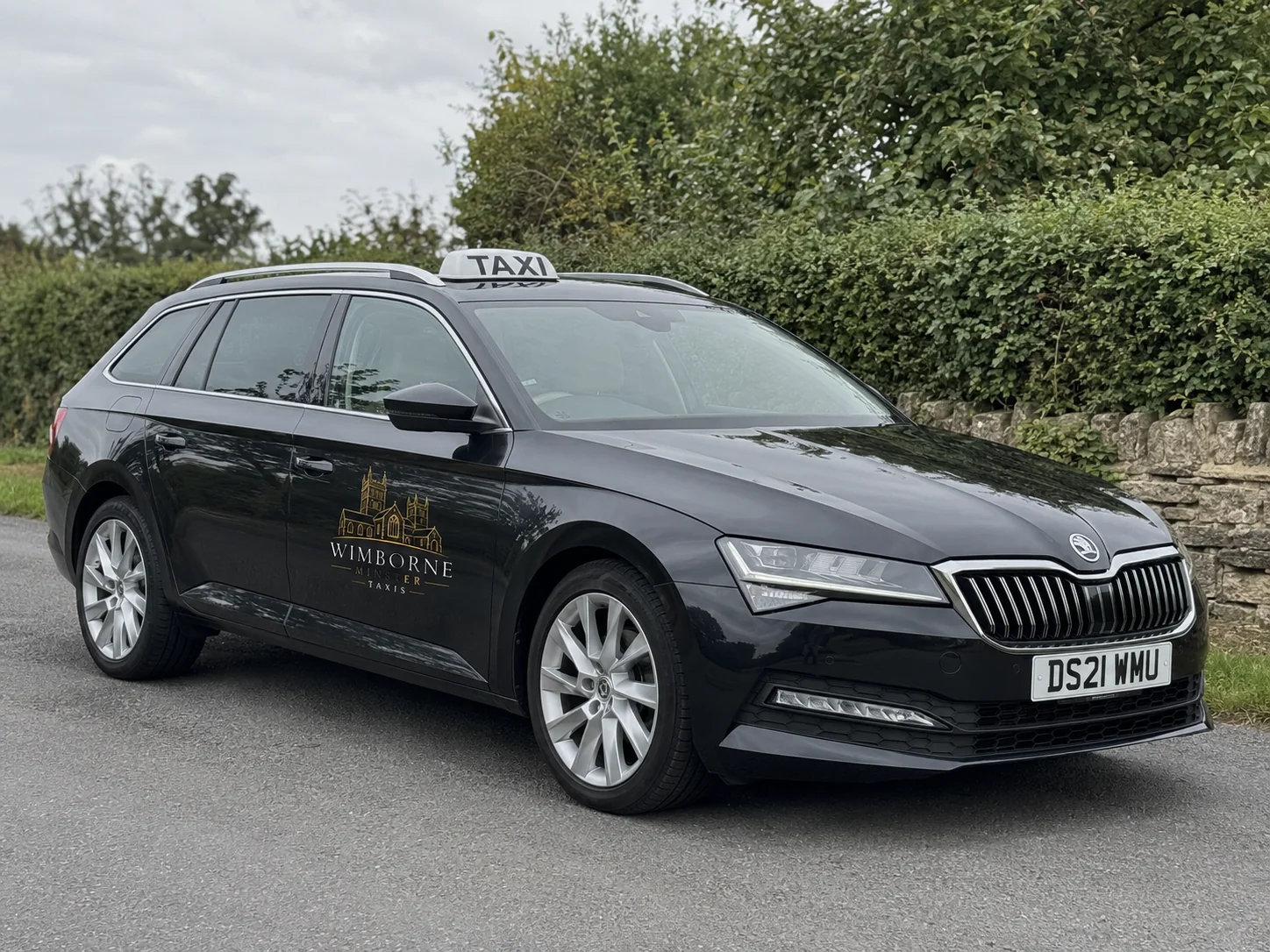 Branded Wimborne Minster taxi vehicle
