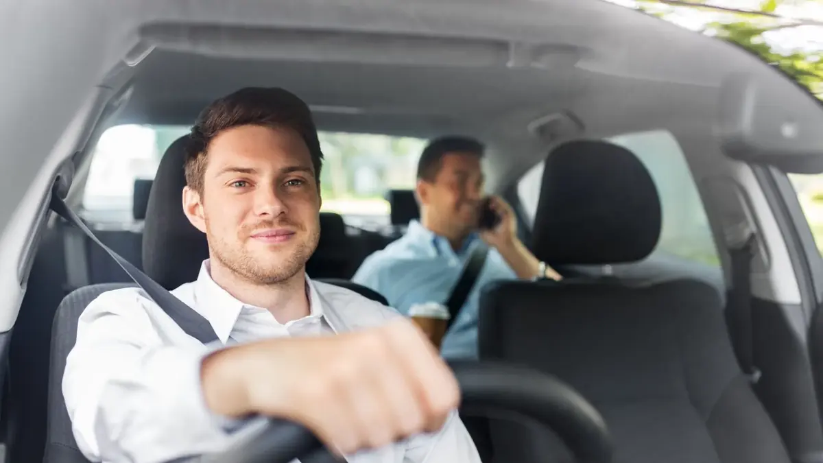 Wimborne Minster taxi driver greeting a passenger